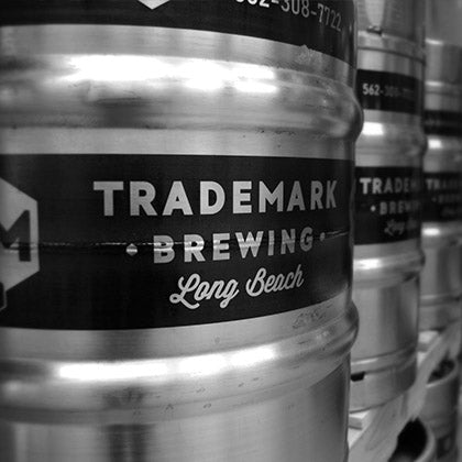 Close up of Trademark Brewing half-barrel kegs
