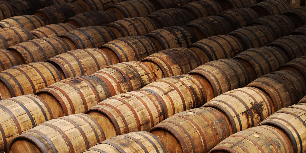 Image of rows upon rows of oak bourbon or wine barrels